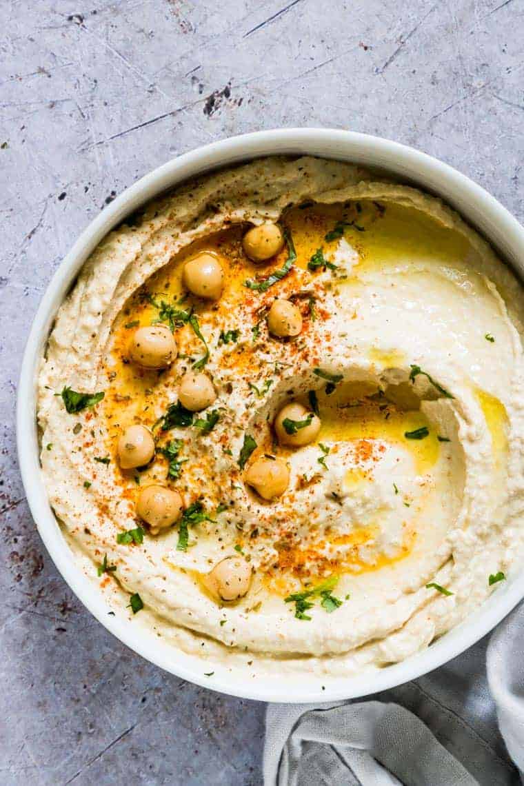 bowl of instant pot hummus with chickpeas and spices