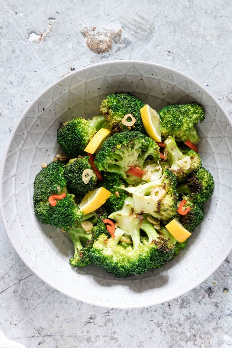 grilled Broccoli in a bowl seasoned with garlic and chilli and lemon