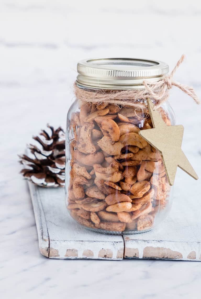 spicy roasted cashews in a mason jar with a christmas tag