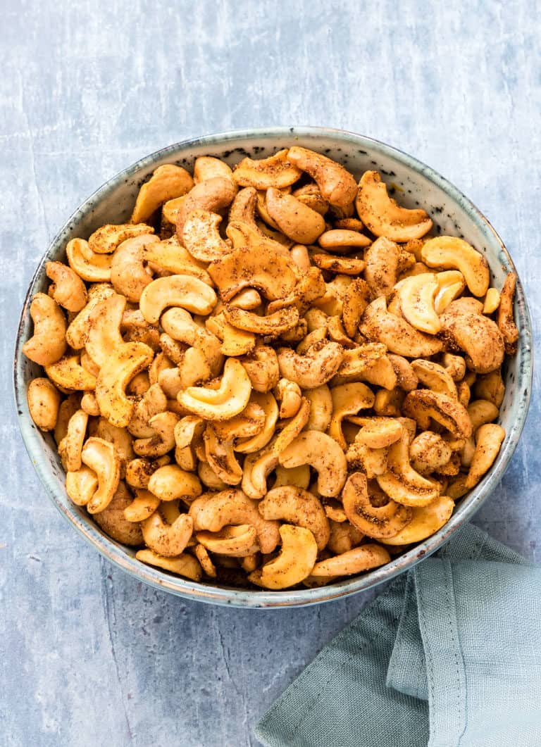 a bowl of spicy roasted cashew nuts - how to roast cashews