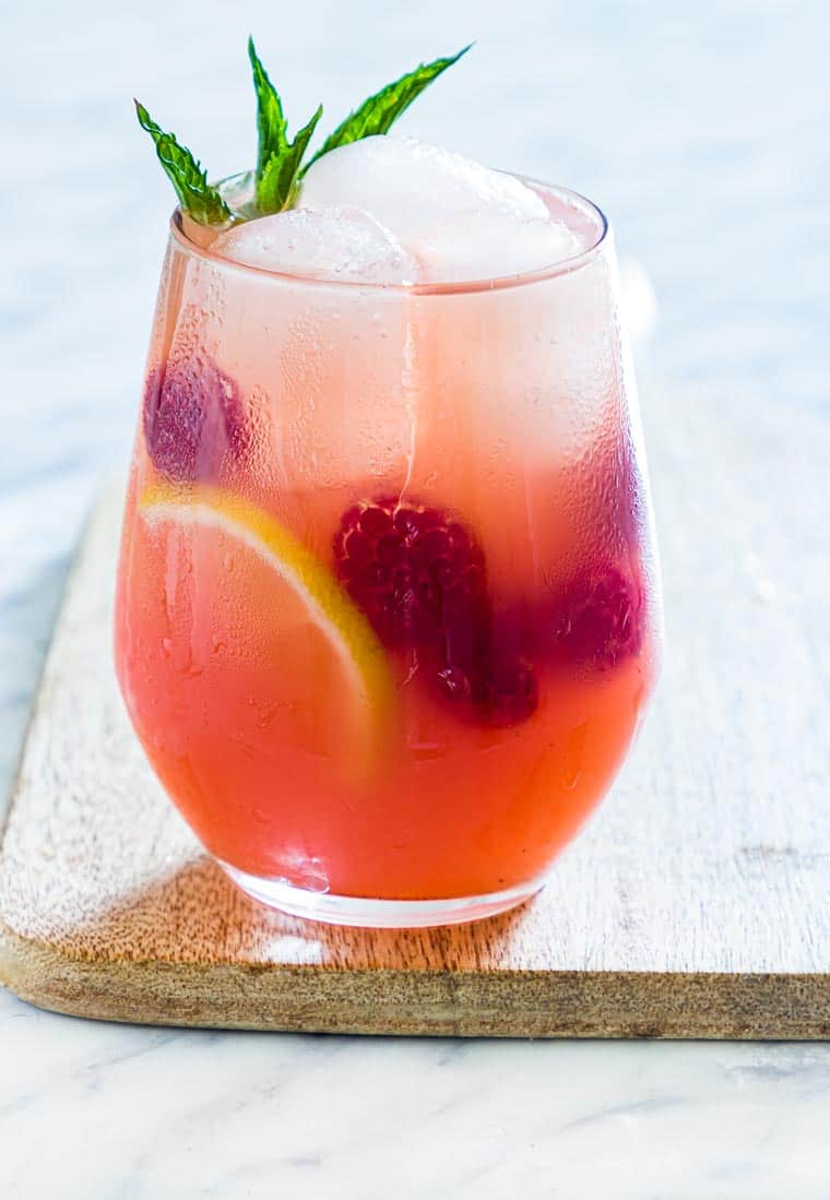 close up of raspberry vodka lemonade on a table