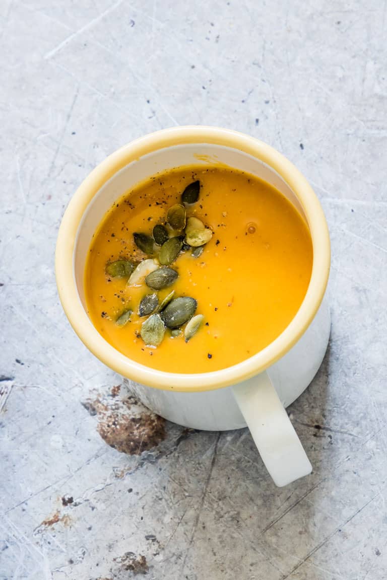a cup of vegan pumpkin soup