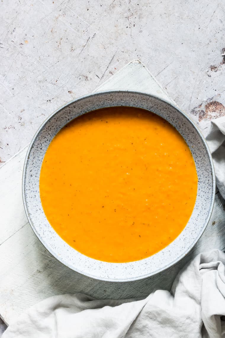 top down view of a bowl filled with vegan pumpkin soup