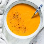 close up of instant pot carrot soup with a spoon