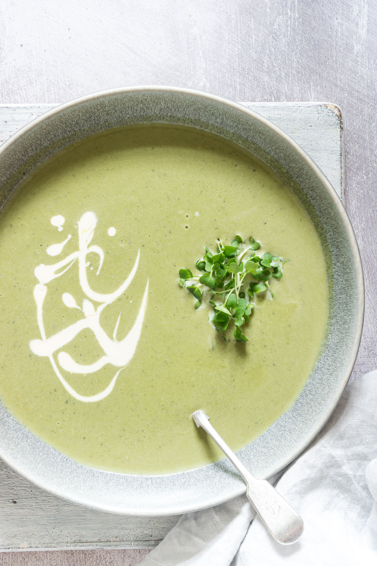 a bowl of ginger spinach soup with cress