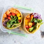 lunchbox eith rainbow vegetable tortilla wrap cut in half