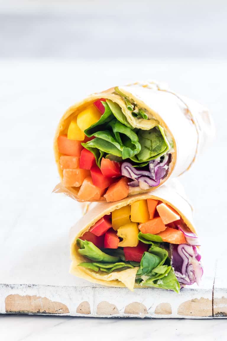 a rainbow vegetable tortilla wrap sliced in half