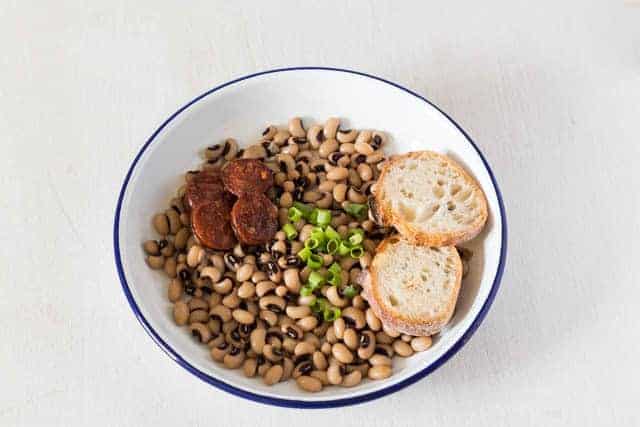 beans in a bowl with 2 slices of bread