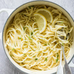 lemon pasta in a saucepan with cutlery