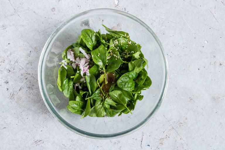 bowl of ingredients to make sesame spinach salad