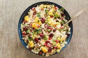 Quick and easy orange pistachio pomegranate couscous salad recipe ready in less than 15 mins. Landscape image. A colourful vegan and vegetarian side dish – recipesfromapantry.com #couscous #couscoussalad #easycouscous #christmasrecipe #howtomakecouscoussalad #vegetariancouscous #moroccancouscous