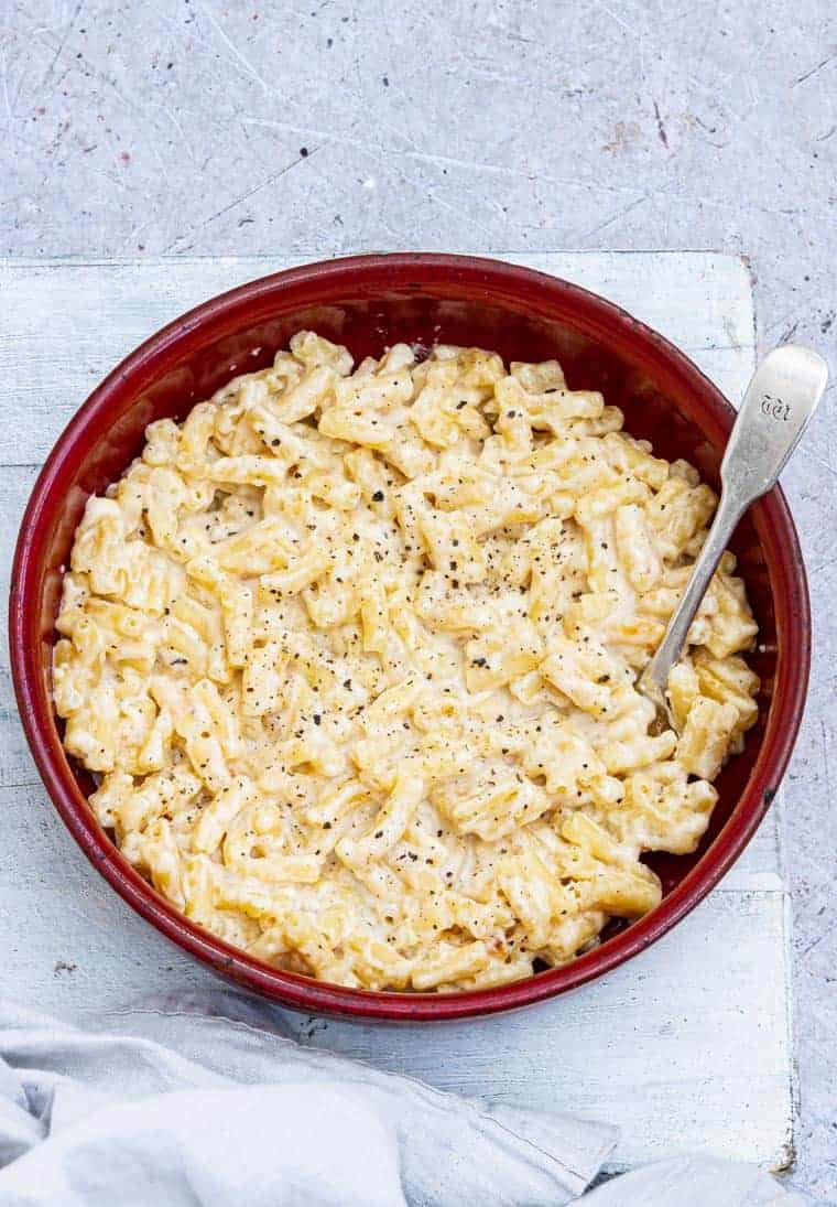 Close up of air fryer mac and cheese in a bowl on a table