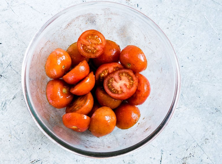 a bowl of seasoned uncooked tomatoes
