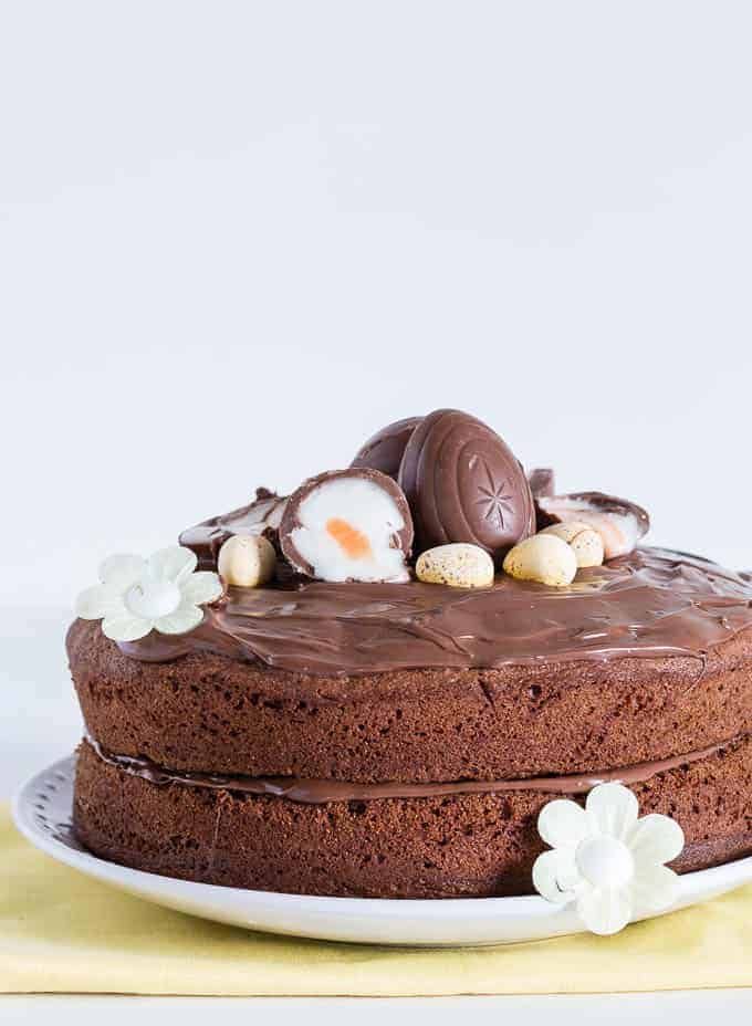 Easy Nutella Cake topped with nutella frosting and some cadbury creme eggs, 