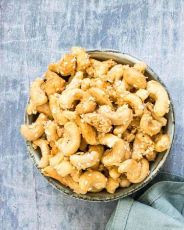 a bowl of roasted coconut cashews
