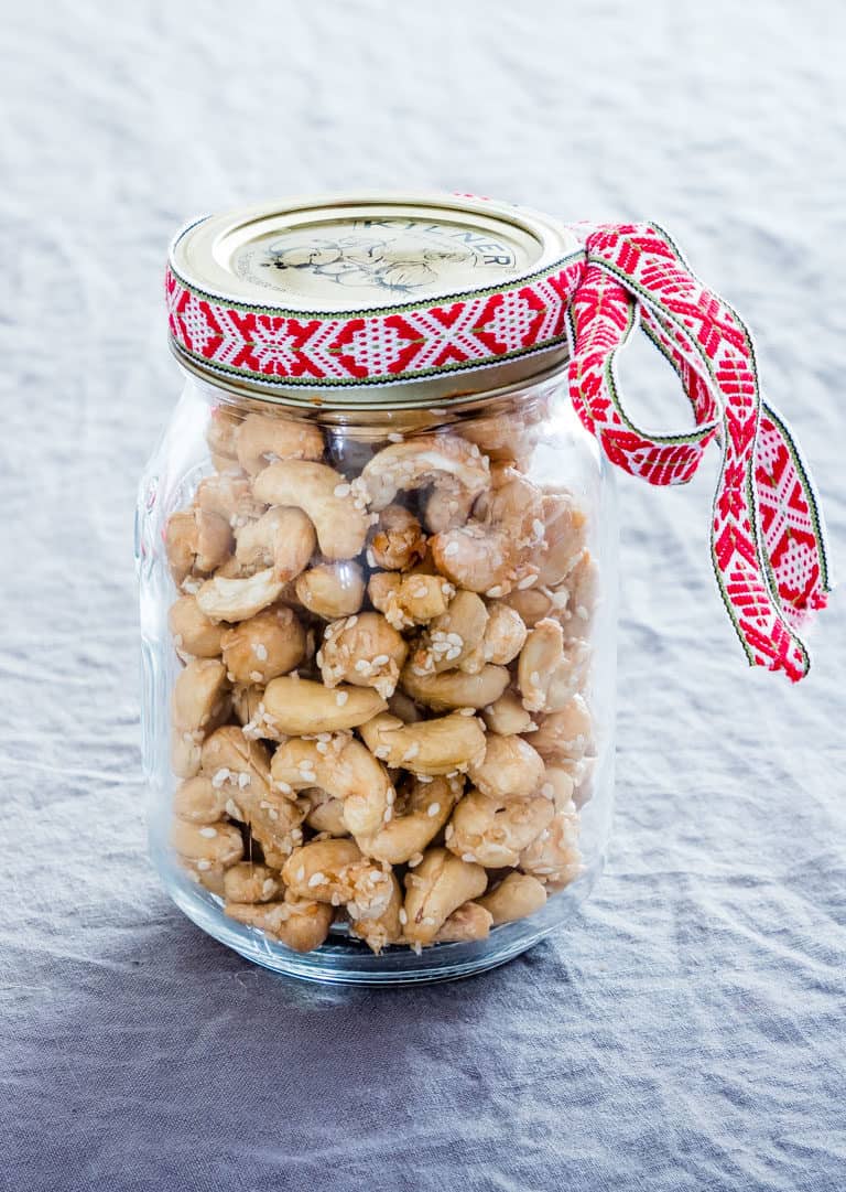 a jar of sesame cashews with a gift ribbon