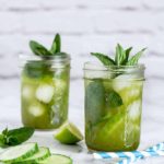 Cucumber Matcha Cocktail in 2 glasses garnished with mint and cucumber