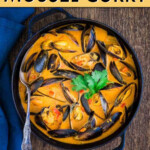 Overhead view of mussel curry in a stew pot