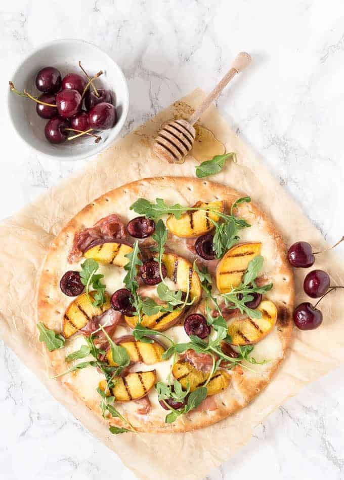 grilled peach, cherry and parma ham pizza