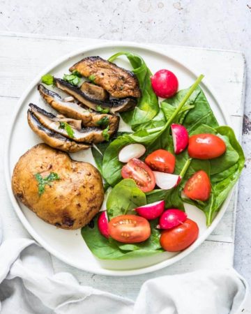 air fryer mushroom steaks served with a green salad