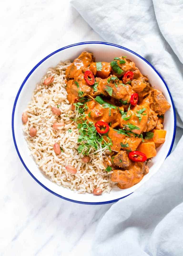 Slow Cooker African Peanut Stew with some rice in a bowl