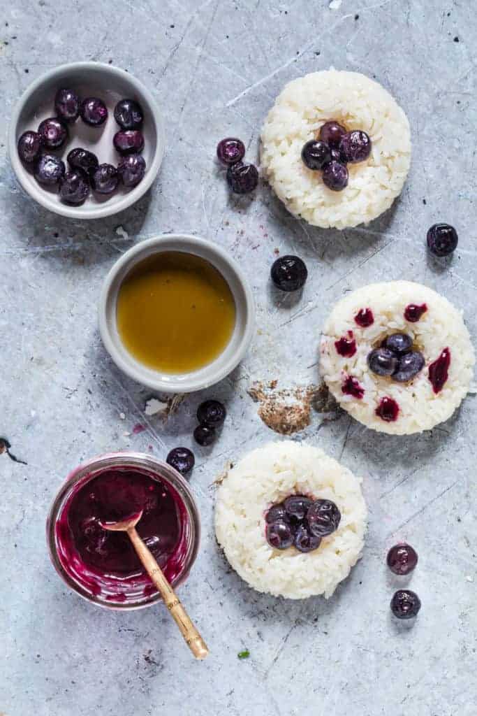 Blueberry Sushi Doughnuts on a table - Recipes From A Pantry