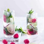 two glasses of Raspberry Mojito - Refreshing & simple raspberry mojito recipe made with 5 ingredients - fresh raspberries