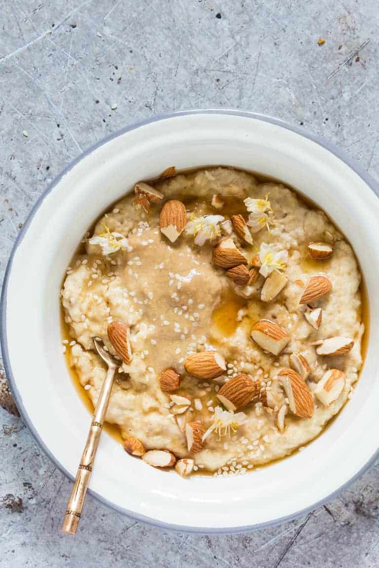 A bowl of gluten-free creamy tahini porridge recipe. 