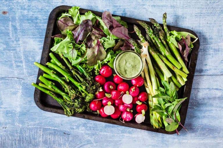 Spring crudities board And Avocado Green Goddess Dip with asparagus, broccoli, radishes, sorrel and mint - recipesfromapantry.com