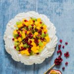 This kiwi mango pavlova with coconut whipped cream is an easy dessert recipe that takes 10 mins to make and guaranteed crowd pleaser. recipesfromapantry.com.
