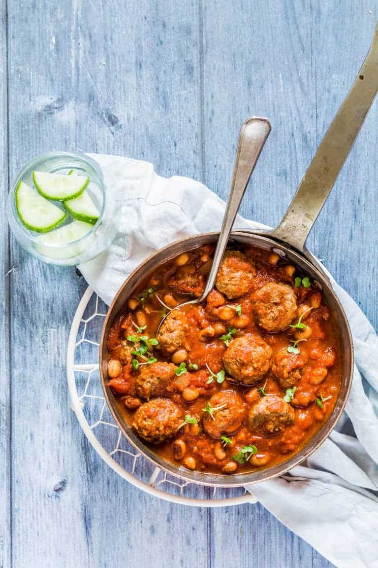 A pot of Weight Watchers meatballs chilli con carne with a glass of courgette infused water