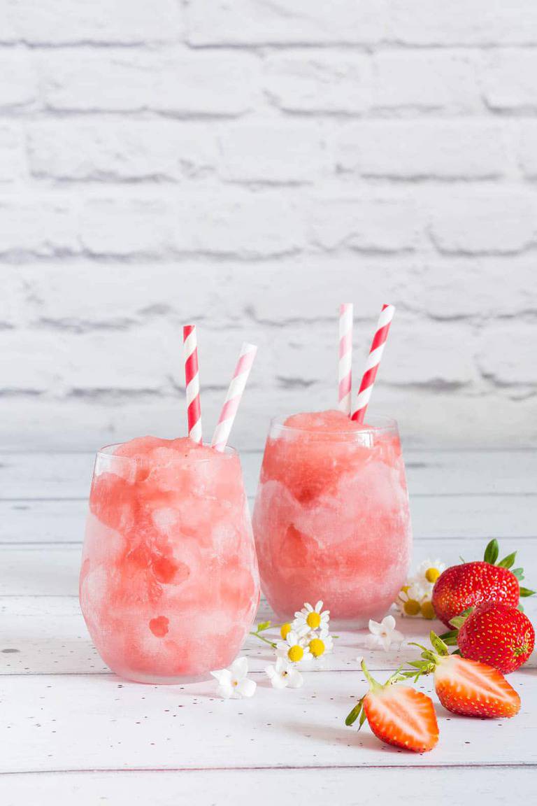 This ice cold strawberry frosé (frozen rosé) recipe is the perfect cooling drink for hot, hot summer days. Try it now. recipesfromapantry.com