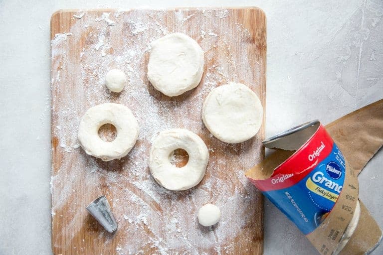 air fryer donuts being cut out using biscuit dough