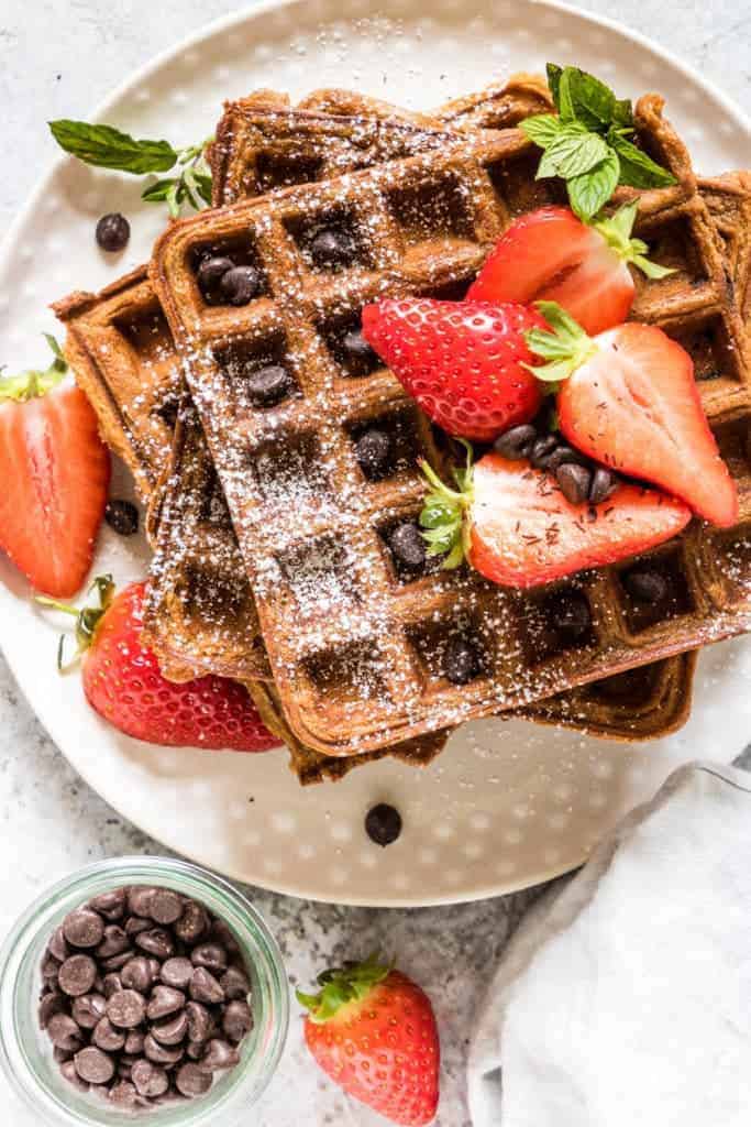Delightfully fluffy & easy chocolate chip sweet potato waffles recipe with a Halloween twist your guests will love. See more at recipesfromapantry.com #sweetpotatowaffles #easysweetpotatowaffles #chocolatechipwaffles #sweetpotatochocolatechipwaffles #wafflerecipes