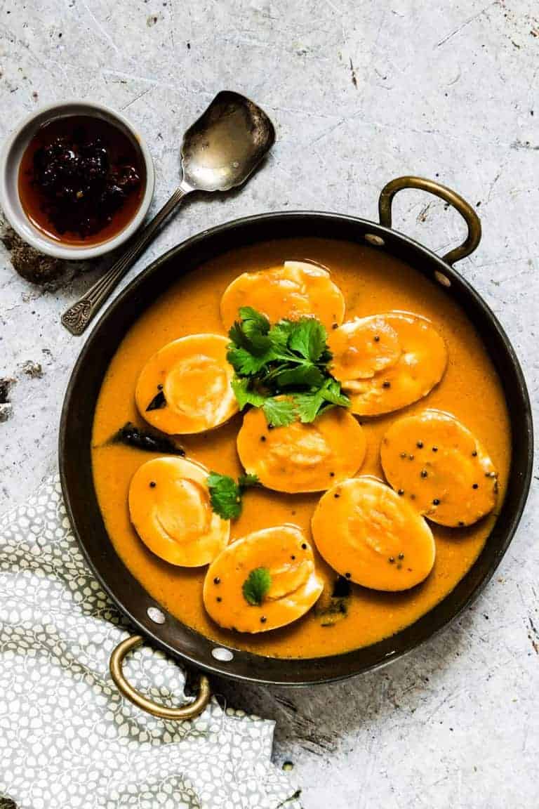 An easy creamy Indian egg curry recipe which is eggs cooked in an aromatic tomato sauce and is suitable for vegetarians. #easyeggcurry #eggcurry #eggcurryrecipe #indianeggcurry #goaneggcurry