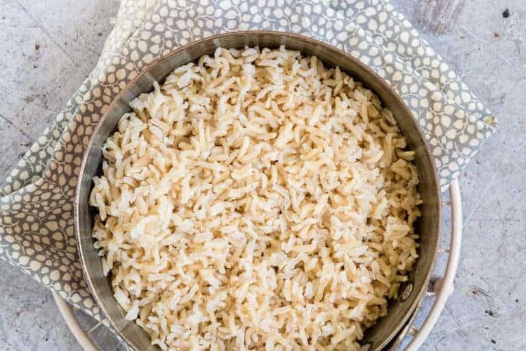Instant Pot Brown Rice in a pot with a spotty cloth