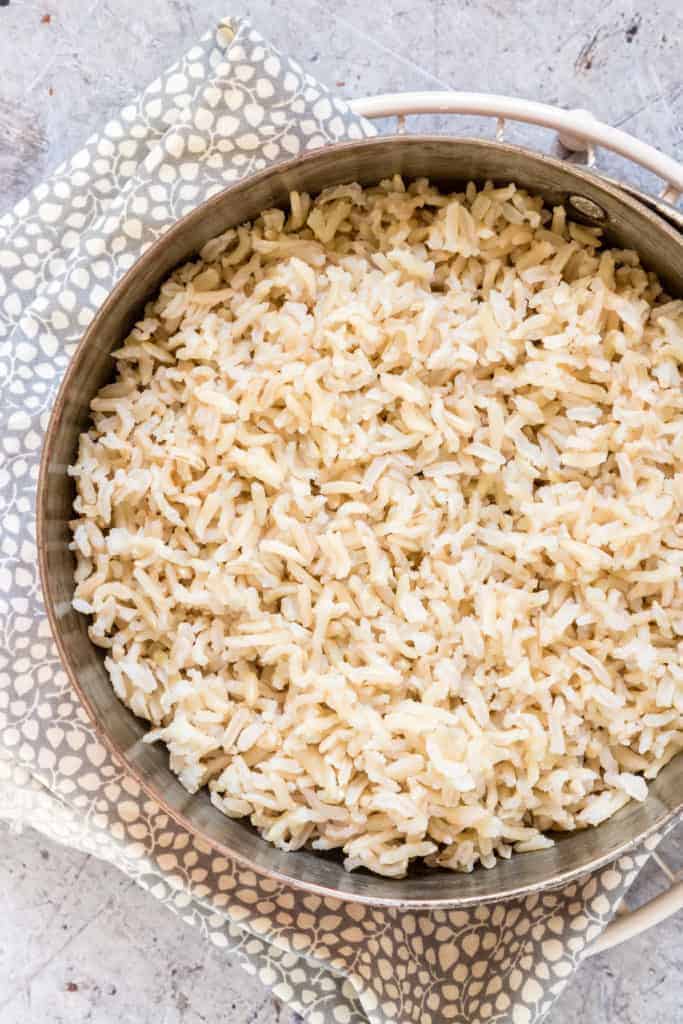  Instant Pot Brown Rice in a pot with a spotty cloth