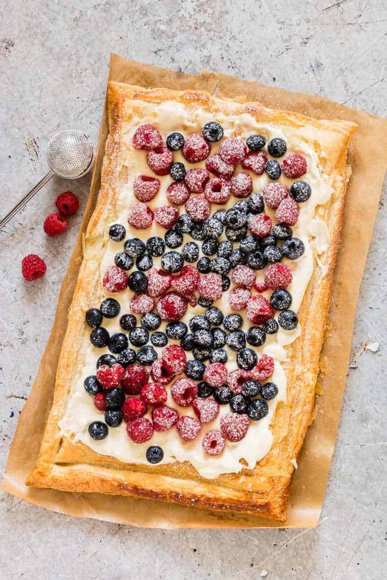 Berries and Cream Cheese Puff Pastry Breakfast Tart on baking paper