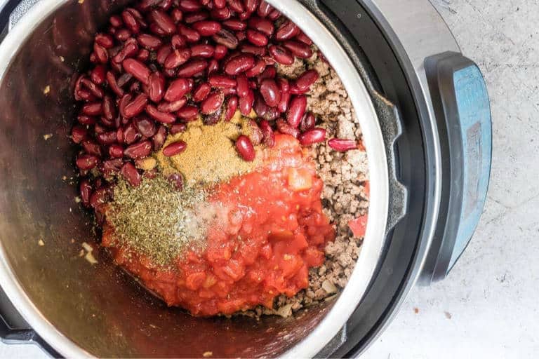 venison chilli (venison chili) ingredients inside an instant pot