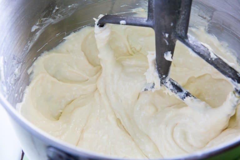 instant pot cheesecake batter closeup with a paddle in the batter