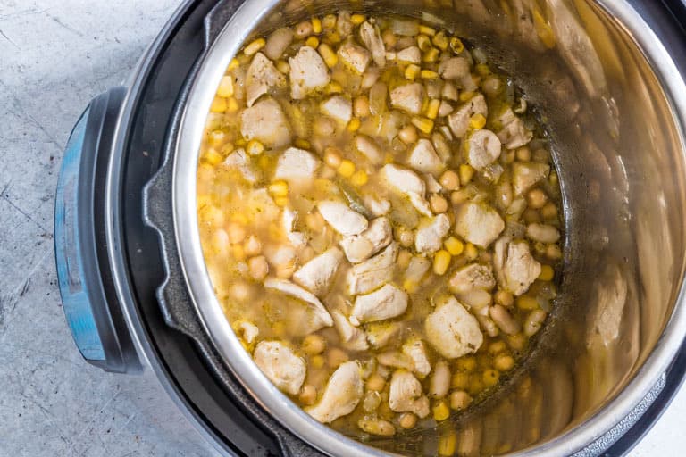 fully cooked instant pot white chicken chili inside an instant pot