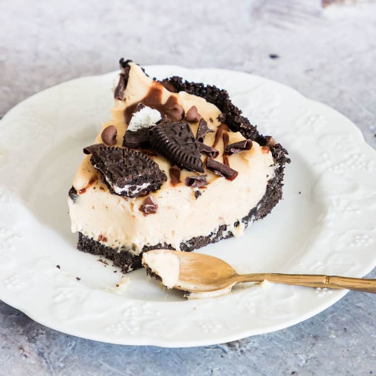 a slice of no bake peanut butter pie with a teaspoon