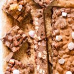 overhead view of no bake rocky road cake sliced into square pieces