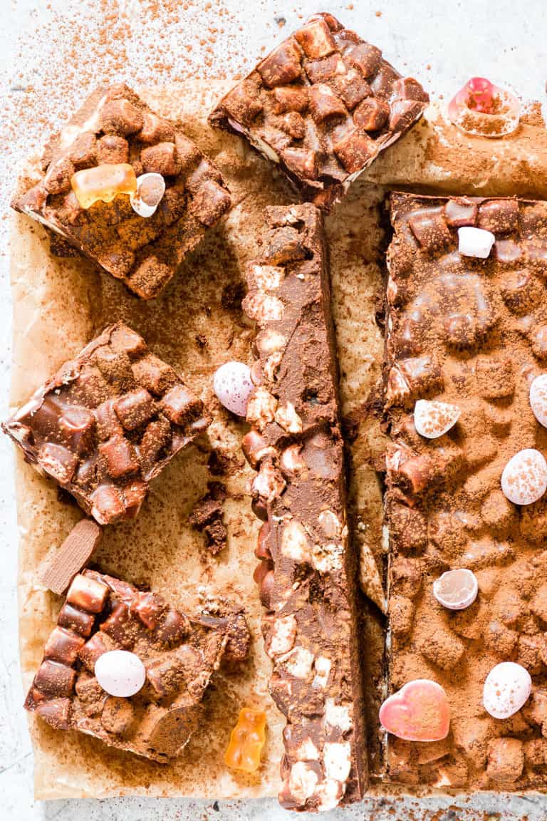 overhead view of no bake rocky road cake sliced into square pieces