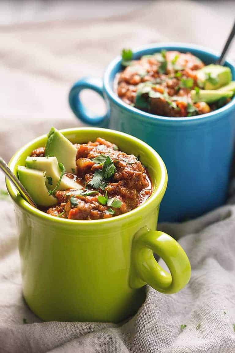 green and blue cups containing homemade chilli