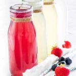 4 bottles of instant pot infused water with fruit and straws