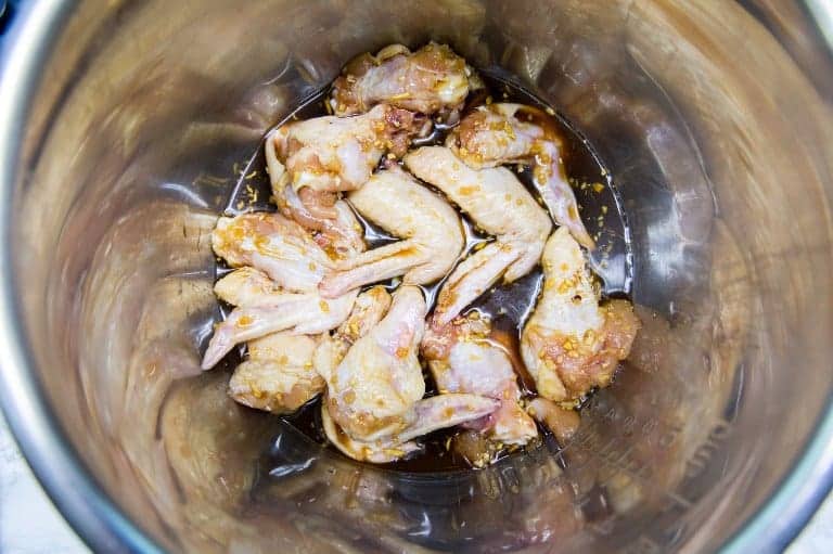 overhead view of chicken inside instant pot for instant pot chicken wings