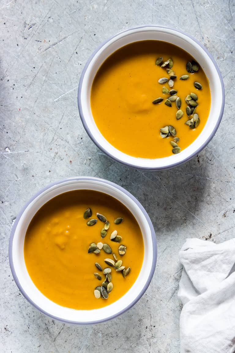 2 bowls of instant pot butternut squash soup with pumpkin seeds