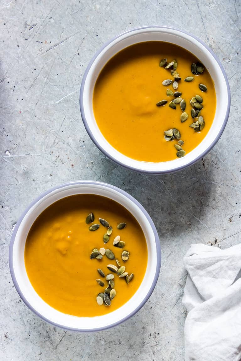 2 bowls of instant pot butternut squash soup with pumpkin seeds