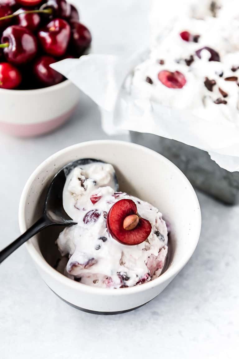 close up of a bowl of low carb ice cream with cherries